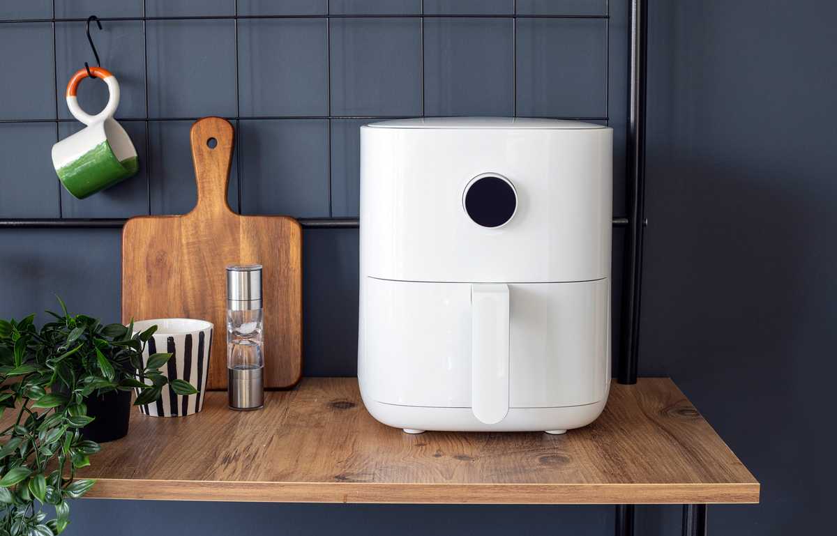 Air fryer in a dark kitchen