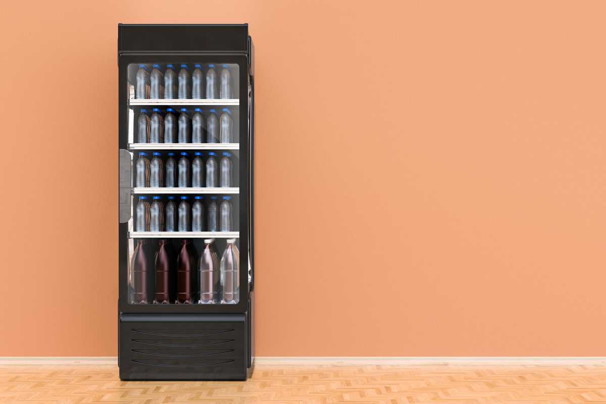 A beverage cooler with a glass front filled with bottles